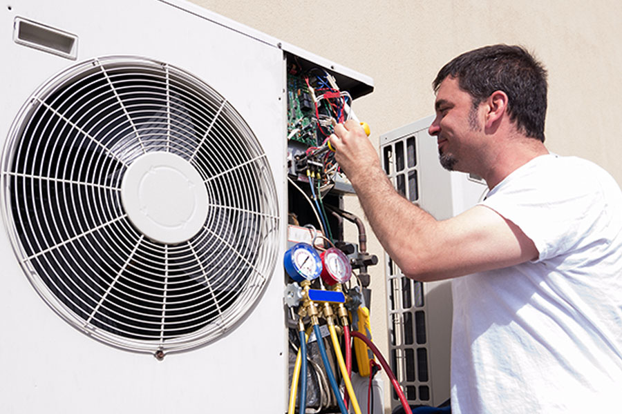 hvac technician repairing unit