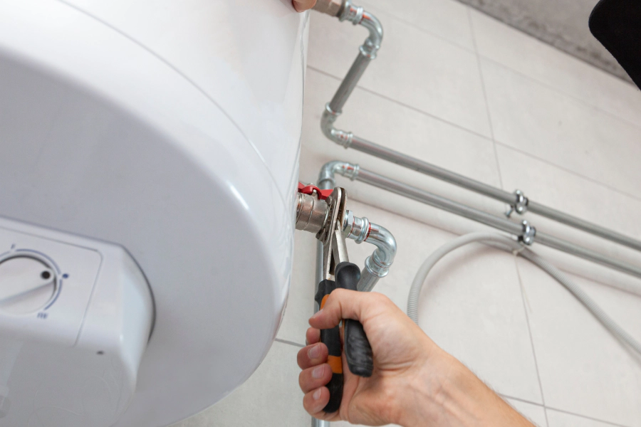 technician repairing water heater chantilly va