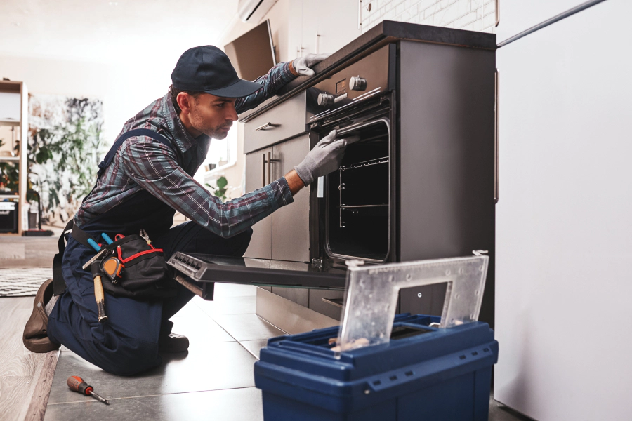 electrician inspecting an oven mclean va